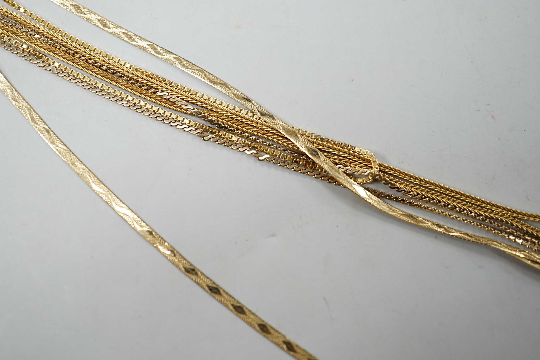 Two modern 9ct gold chains, longest 50cm, 6.3 grams, a 14k chain, 46cm, 2.6 grams and a 750 yellow metal chain, 38cm, 3.5 grams.